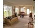 Bright living room features a comfy sofa and large windows at 9608 41St N St # 2, Pinellas Park, FL 33782