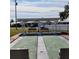 Two shuffleboard courts with covered seating areas at 9608 41St N St # 2, Pinellas Park, FL 33782