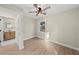 Well-lit bedroom with ceiling fan and en-suite bathroom at 1104 S Lois Ave, Tampa, FL 33629