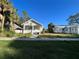 White bungalow home with a front yard at 1105 W De Leon St, Tampa, FL 33606