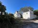 White home with a detached building and alley access at 1105 W De Leon St, Tampa, FL 33606