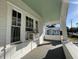 Front porch with a view of a neighboring house and the street beyond at 1105 W De Leon St, Tampa, FL 33606