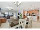 Open concept dining area with kitchen view and seating for six at 11804 Valhalla Woods Dr, Riverview, FL 33579