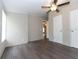 Spacious bedroom with ceiling fan and wood-look flooring at 12816 Midvale Ave, New Port Richey, FL 34654