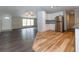 Modern kitchen with white cabinets and wood flooring at 12816 Midvale Ave, New Port Richey, FL 34654