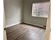 Simple bedroom with wood-look flooring and neutral walls at 1299 Birchcrest Blvd, Port Charlotte, FL 33952