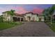 Two-story home with a three-car garage and a brick driveway at 13819 Swiftwater Way, Bradenton, FL 34211