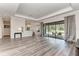 Open living area with hardwood floors, view of kitchen and backyard at 13819 Swiftwater Way, Bradenton, FL 34211