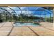 Relaxing pool and spa with screened enclosure and lake view at 13819 Swiftwater Way, Bradenton, FL 34211