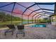 Enclosed pool and spa with a stunning sunset view at 13819 Swiftwater Way, Bradenton, FL 34211