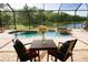Relaxing pool area with a patio and lake view at 13819 Swiftwater Way, Bradenton, FL 34211