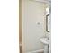Simple half bathroom with pedestal sink and mirror at 14003 Citrus Crest Cir, Tampa, FL 33625