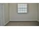 Empty carpeted bedroom with a window and neutral color scheme at 14003 Citrus Crest Cir, Tampa, FL 33625