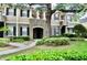 Two-story townhome with landscaping and walkway at 14003 Citrus Crest Cir, Tampa, FL 33625