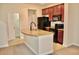 Kitchen with island, granite counters, and dark cabinets at 14003 Citrus Crest Cir, Tampa, FL 33625