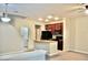 Kitchen with island, granite counters, and dark cabinets at 14003 Citrus Crest Cir, Tampa, FL 33625