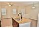 Kitchen island with granite countertop and double sink at 14003 Citrus Crest Cir, Tampa, FL 33625