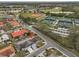Aerial showcasing house location and proximity to community amenities at 1601 Woodmar Dr, Sun City Center, FL 33573