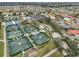 Aerial view showing tennis courts and community at 1601 Woodmar Dr, Sun City Center, FL 33573