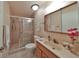 Bathroom with shower and updated vanity at 1601 Woodmar Dr, Sun City Center, FL 33573