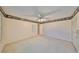 Bedroom with ceiling fan and built-in closets at 1601 Woodmar Dr, Sun City Center, FL 33573