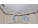 Bright bedroom with ceiling fan and window at 1601 Woodmar Dr, Sun City Center, FL 33573