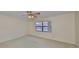 Charming bedroom with ceiling fan and carpeted floor at 1601 Woodmar Dr, Sun City Center, FL 33573
