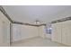 Bedroom with ceiling fan and ample closet space at 1601 Woodmar Dr, Sun City Center, FL 33573