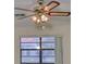 Bedroom featuring ceiling fan and window at 1601 Woodmar Dr, Sun City Center, FL 33573