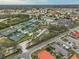 Aerial view of community featuring tennis courts and clubhouse at 1601 Woodmar Dr, Sun City Center, FL 33573