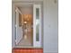 Inviting entryway with tiled floor and glass-paneled door at 1601 Woodmar Dr, Sun City Center, FL 33573