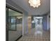 Bright entryway with tile flooring and views to the kitchen and living room at 1601 Woodmar Dr, Sun City Center, FL 33573
