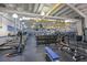 Fitness center with various exercise machines and weights at 1601 Woodmar Dr, Sun City Center, FL 33573