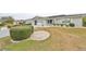 Attractive single-story home with well-manicured lawn and landscaping at 1601 Woodmar Dr, Sun City Center, FL 33573