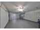 Spacious garage with built-in storage and epoxy floor at 1601 Woodmar Dr, Sun City Center, FL 33573