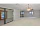 Spacious Gathering room with sliding glass doors leading to the outdoors at 1601 Woodmar Dr, Sun City Center, FL 33573