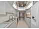Modern kitchen with gray cabinets and stainless steel appliances at 1601 Woodmar Dr, Sun City Center, FL 33573