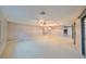 Spacious living room with access to kitchen and dining areas at 1601 Woodmar Dr, Sun City Center, FL 33573