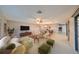 Bright living room features a comfortable sofa and stylish coffee table at 1601 Woodmar Dr, Sun City Center, FL 33573