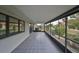 Spacious screened porch with tiled floors at 1601 Woodmar Dr, Sun City Center, FL 33573