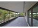 Spacious screened porch with tile flooring, offering peaceful views at 1601 Woodmar Dr, Sun City Center, FL 33573