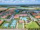 Community overview showcasing homes, pool, and recreational amenities at 16909 April Plush Dr, Wimauma, FL 33598