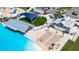 Resort-style pool with expansive deck, cabanas, and sand beach at 16909 April Plush Dr, Wimauma, FL 33598
