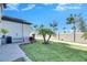 Small grassy backyard with a paved patio at 16909 April Plush Dr, Wimauma, FL 33598