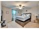 Bedroom with a queen-size bed and window at 16909 April Plush Dr, Wimauma, FL 33598