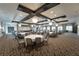 Large community room with multiple tables and chairs, perfect for events at 16909 April Plush Dr, Wimauma, FL 33598