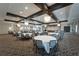 Large community room with multiple tables and chairs, perfect for events at 16909 April Plush Dr, Wimauma, FL 33598