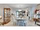 Elegant dining room featuring a large table and stunning chandelier at 16909 April Plush Dr, Wimauma, FL 33598