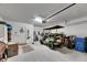 Spacious garage, golf cart, and storage area at 16909 April Plush Dr, Wimauma, FL 33598