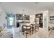 Modern kitchen with dark cabinetry, granite counters, and an island at 16909 April Plush Dr, Wimauma, FL 33598